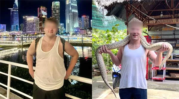 Man posing in front of Ho Chi Minh City Hall